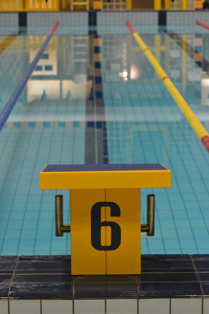 services-01 Indoor swimming pool with starting block number six, perfect for pool sports and training.